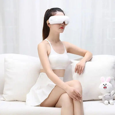 Masajista de relajación de ojos negros Lable personalizado con compresión caliente de calefacción y masaje eléctrico de vibración